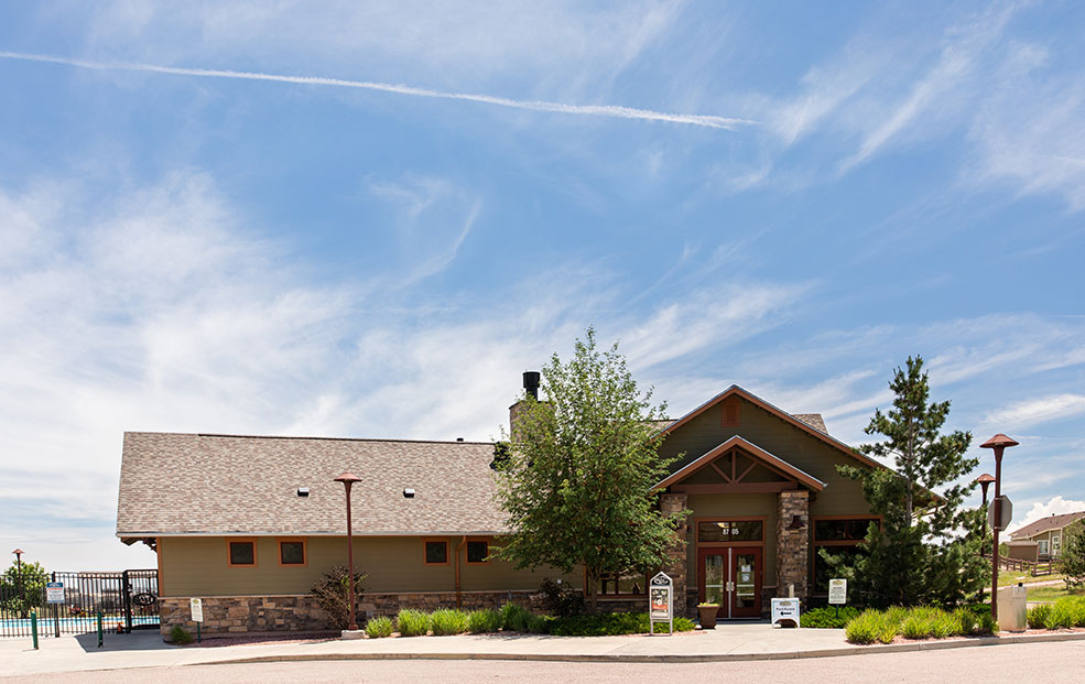 Club house building with blue sky in the background