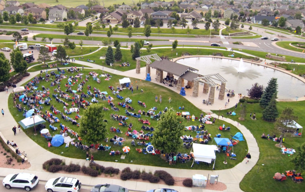 Drone view of an outdoor summer concert hosted at Wolf Ranch