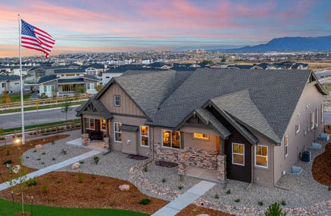 9416 Wolf Valley Dr. exterior shot with flags