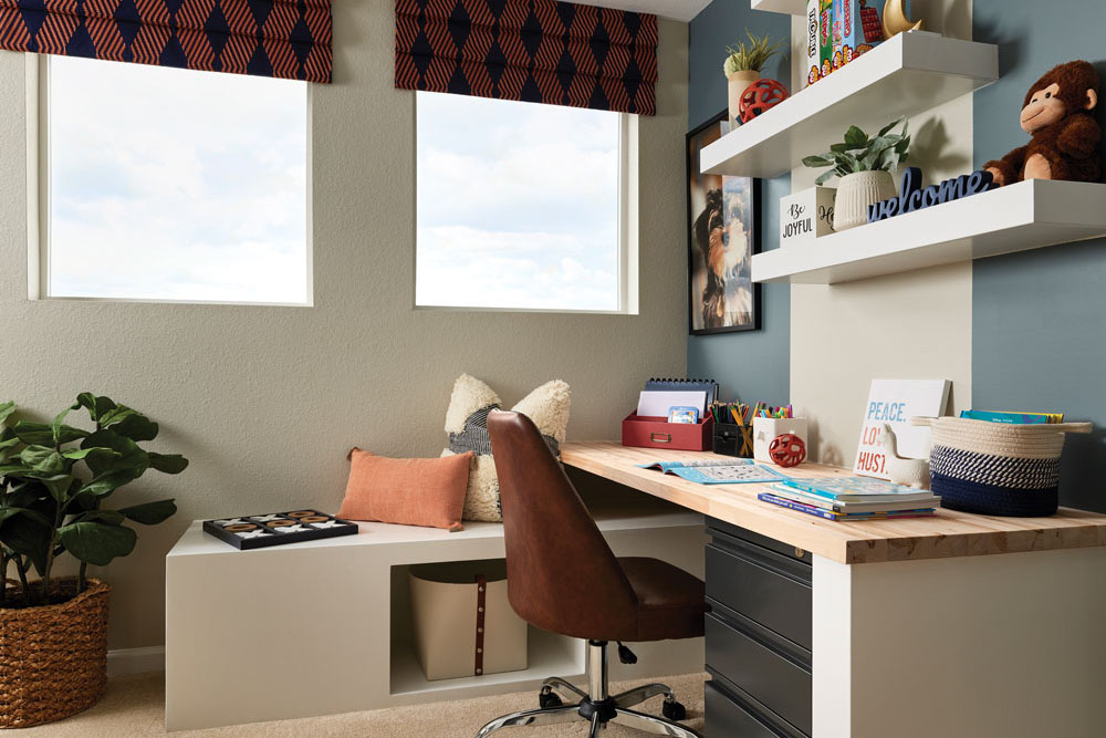 A chic home office with a built-in desk and lots of natural light