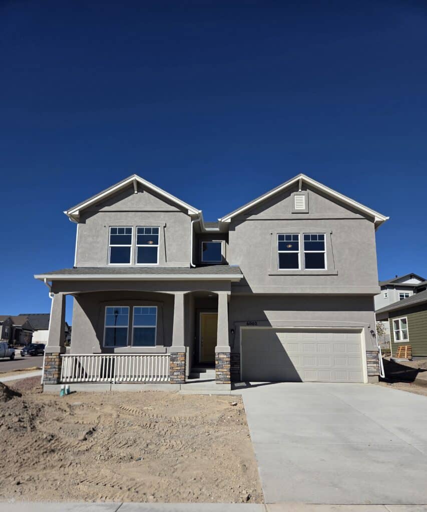 6002 Miller Run Place — Challenger Homes 4-car garage two-story at Wolf Ranch in Colorado Springs